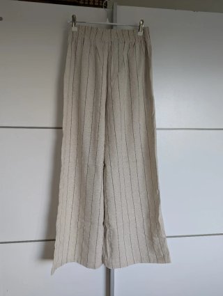 Pantalón fluido rayas beige y negro