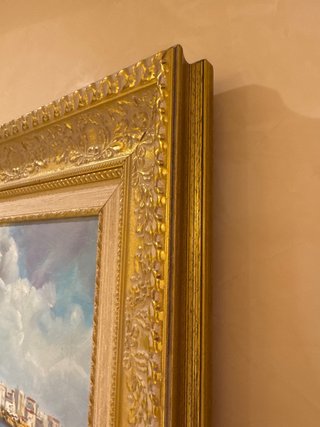 Cuadro pintado al óleo con marco dorado