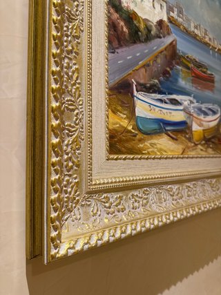 Cuadro pintado al óleo con marco dorado