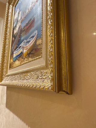 Cuadro pintado al óleo con marco dorado