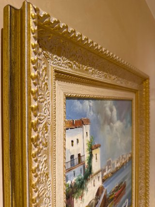 Cuadro pintado al óleo con marco dorado