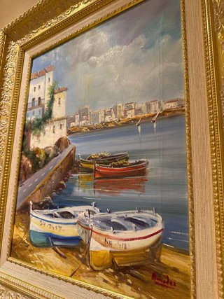 Cuadro pintado al óleo con marco dorado