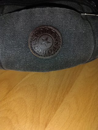 Riñonera deportiva lona gris