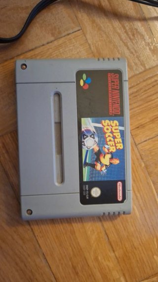 Super Nintendo Entertainment System y juego mario
