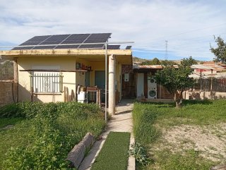 Parcela con casa prefabricadas,arboles,agua,luz y,