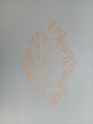 Mesa auxiliar ovalada azul y dorada