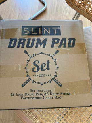 Pad de práctica SLINT y baquetas