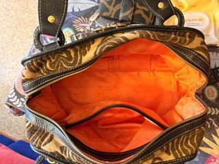 Bolso Tous estampado cebra y detalles dorados