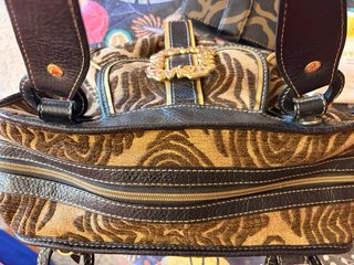 Bolso Tous estampado cebra y detalles dorados