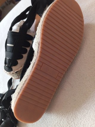 Zapatillas planas con lazo negro