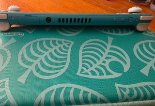 Nintendo Switch Lite Verde con funda Animal Crossi