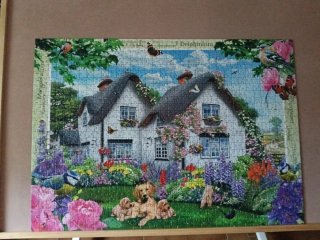 Puzzle Ravensburger Delphinium Cottage 1000 piezas