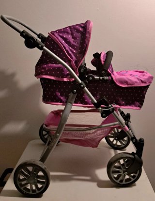 Cochecito de muñeca morado y rosa
