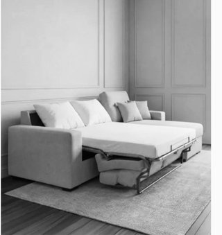 Sofá cama gris de tela