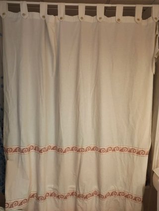 Cortina de ducha tela con detalles marinos.