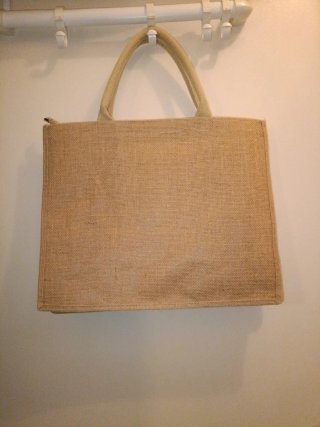 Bolso de tela beige y rosa con estampado