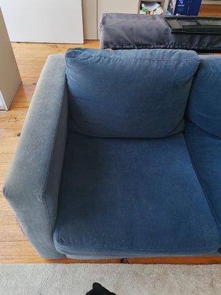 Sofá azul de tecido para doação