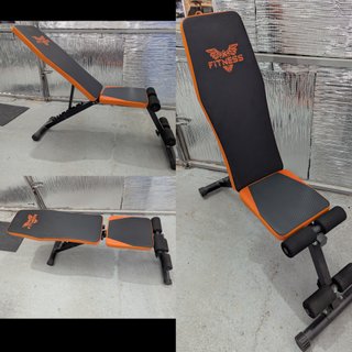 Banco de pesas ajustable naranja y negro