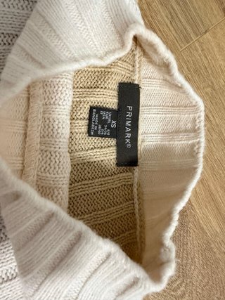 Jersey de punto beige y blanco