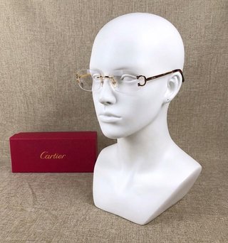 Gafas Cartier doradas
