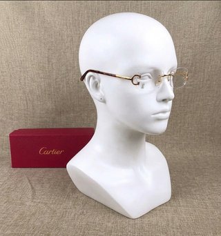 Gafas Cartier doradas