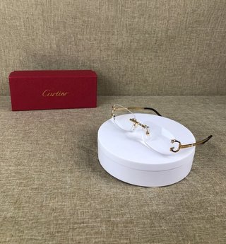 Gafas Cartier doradas