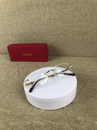 Gafas Cartier doradas