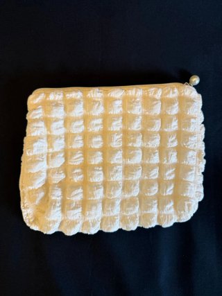 Pochette panna con zip e perla