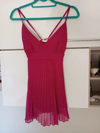 Top lungo fucsia plissettato