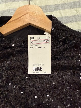 Blusa de lentejuelas negra