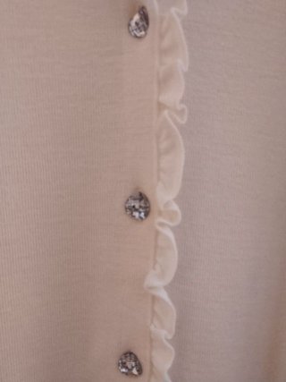Chaqueta beige con cordones y flecos