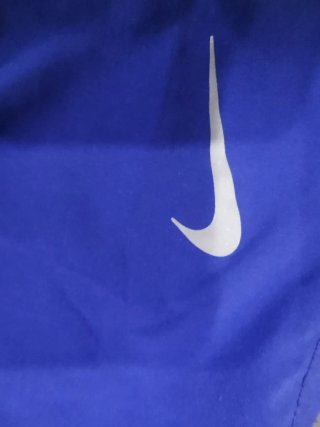 Pantalón corto running Nike azul y verde
