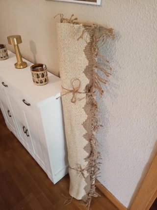Alfombra de yute beige y marrón