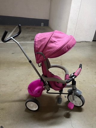 Triciclo infantil rosa con capota