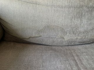 Sofá gris IKEA con puff