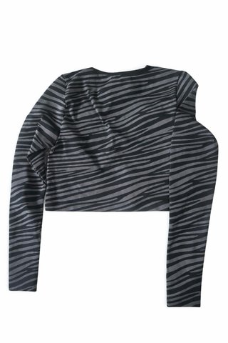 Top deportivo Primark cebra manga larga