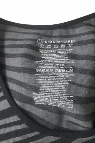 Top deportivo Primark cebra manga larga