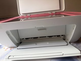 Impresora HP rosa y blanca