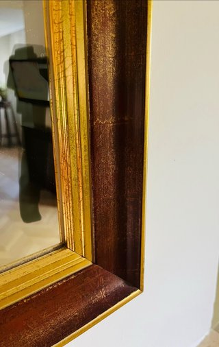 Specchio con cornice in legno e oro