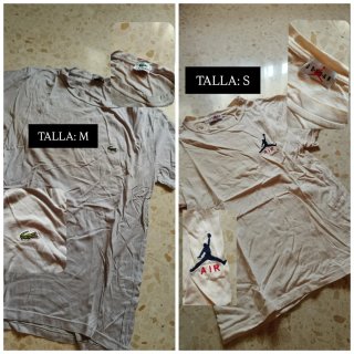 Caja de camisetas de distintas marcas y tallas.