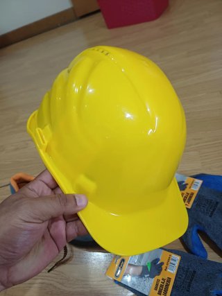 Botas de seguridad grises y naranjas, caso y guant