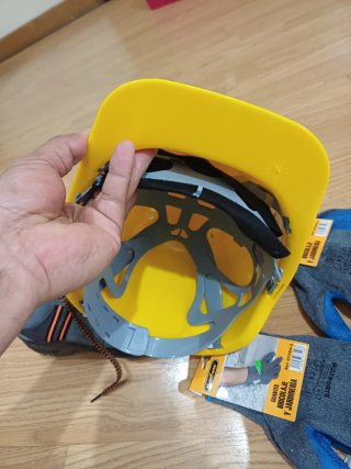 Botas de seguridad grises y naranjas, caso y guant