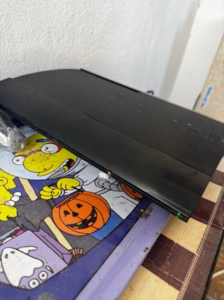 PS3 con mando y 4 juegos
