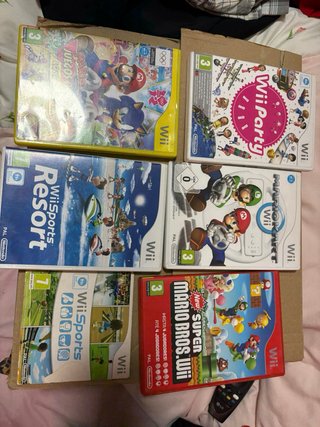 Nintendo Wii + Wii Balance Board + 10 juegos