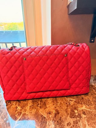 Borsa da viaggio Chanel pelle rossa martellata