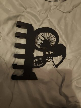 Colgador de pared con diseño de ciclista de metal