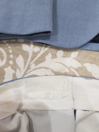 Traje chaqueta y pantalón azul grisáceo