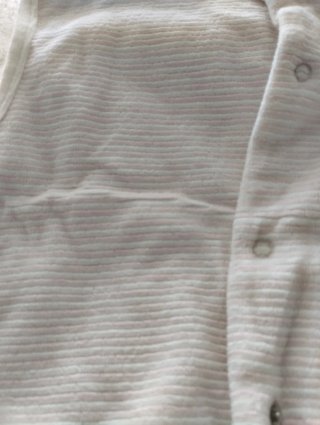Saco de bebé blanco con hipopótamo