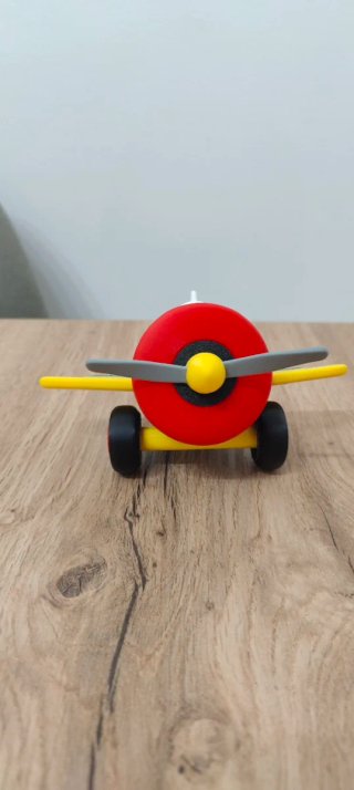 Avión de juguete azul y amarillo