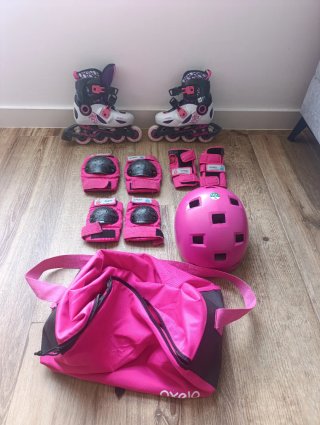 Patines rosas con protecciones y bolsa
